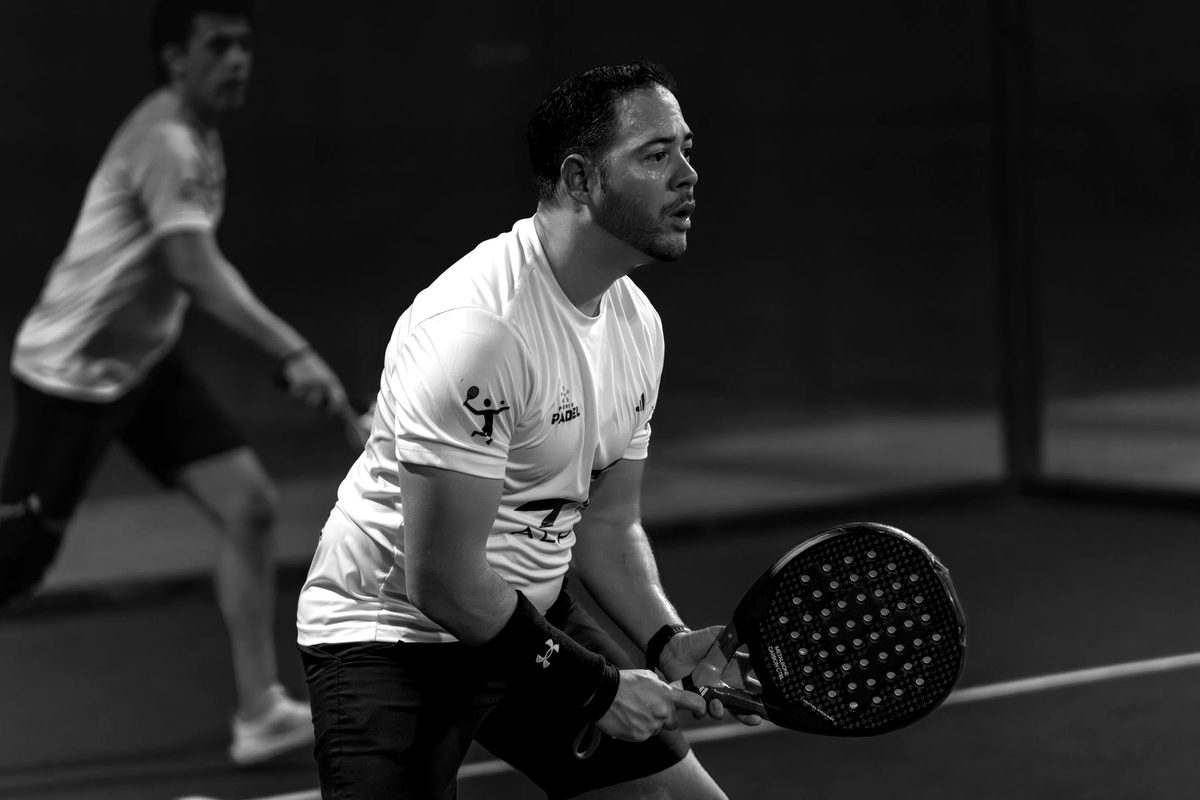 Two players at the net during a rally