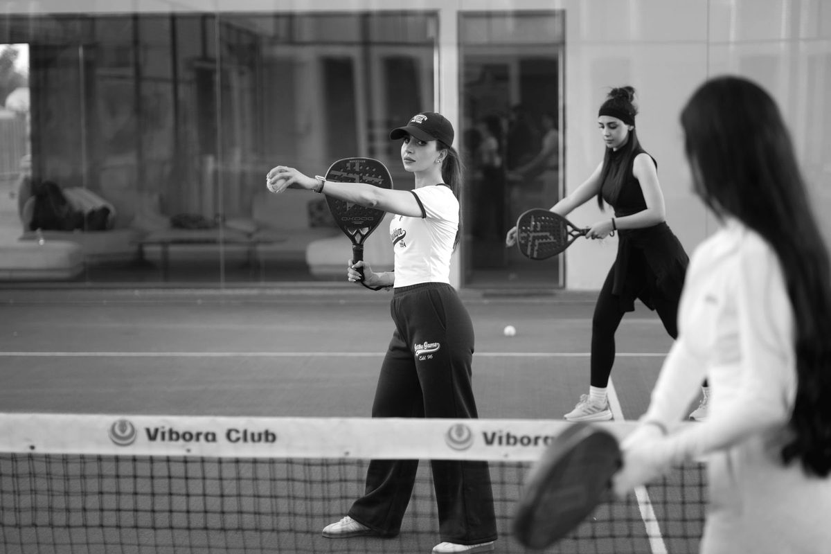 Women playing padel together